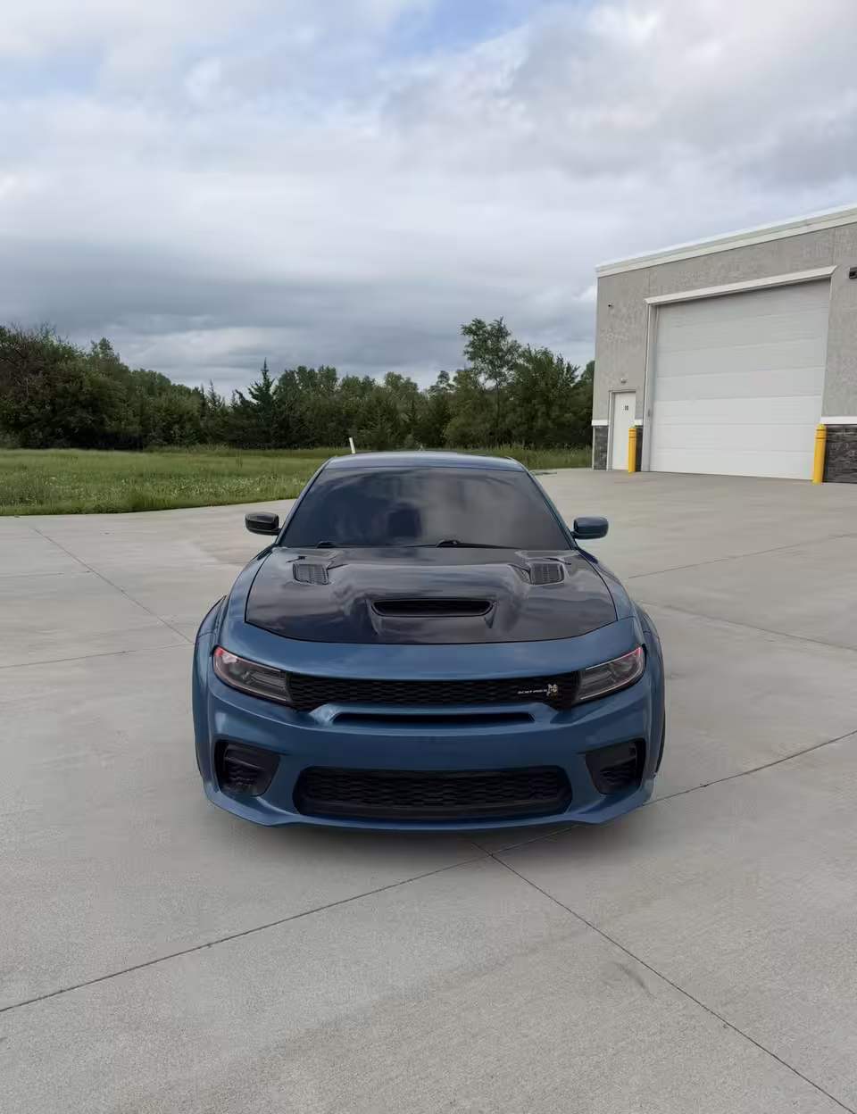 Blue Dodge Charger Scat Pack with tinted windows