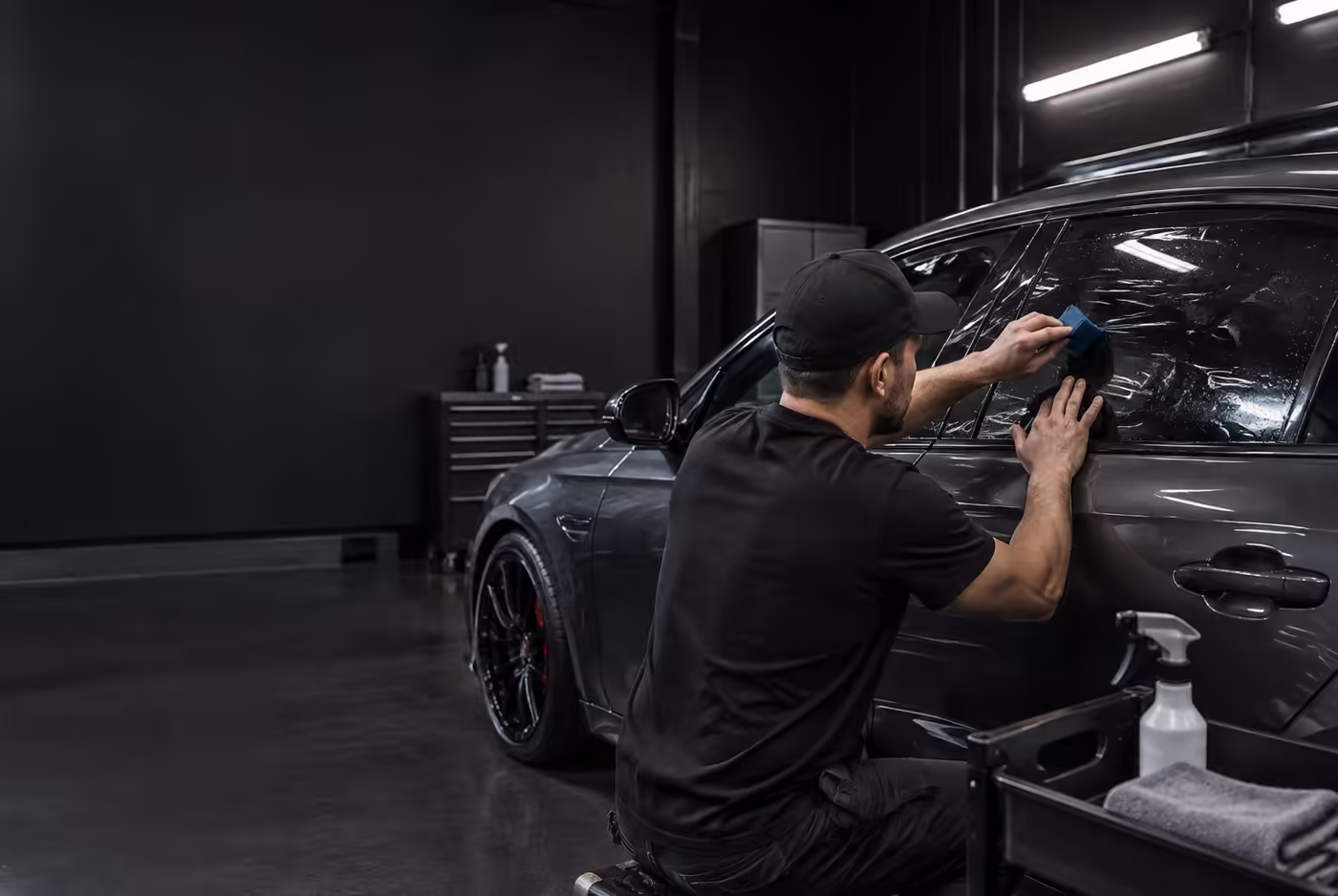 Kingp1n Tints installer applying window film